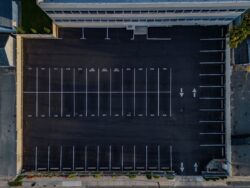 Top,Down,Shot,,Directly,Over,An,Empty,Office,Building,Paved